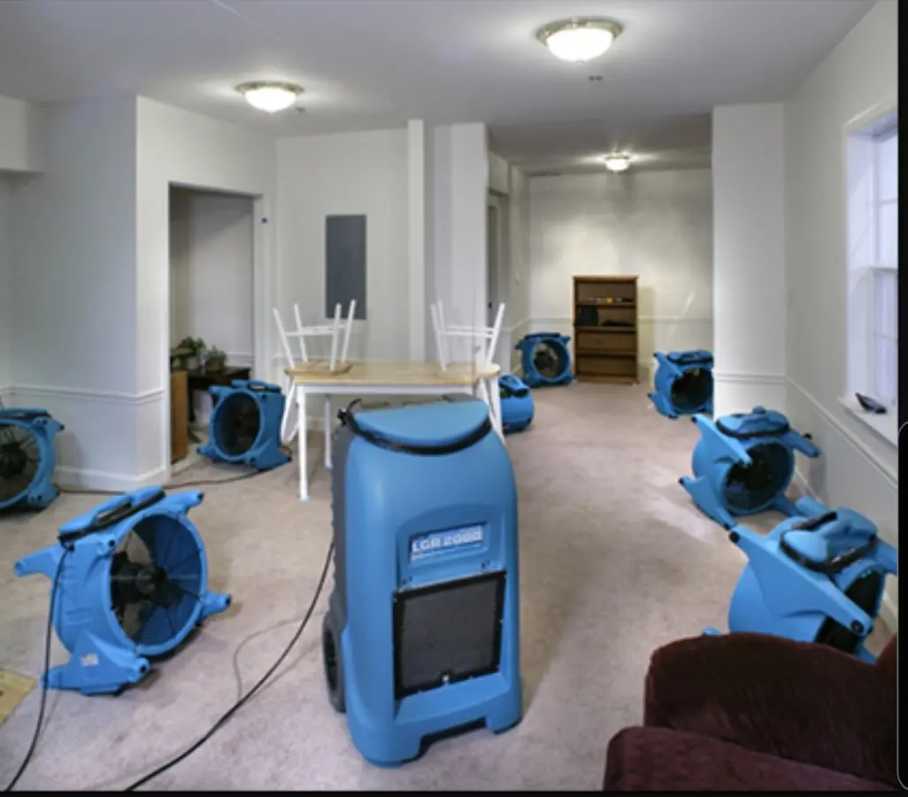 Air movers and dehumidifier setup for Water Damage Restoration in Stanton
