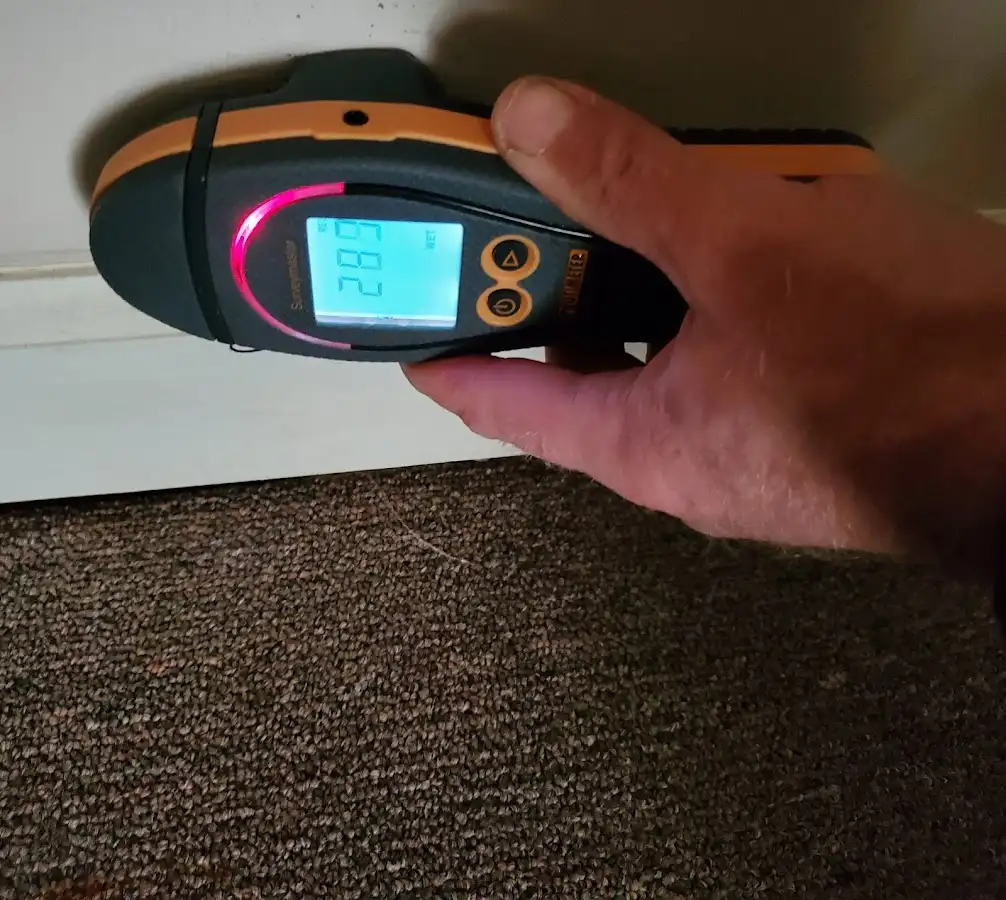 Moisture detection at baseboard during Storm Damage Restoration in Stanton